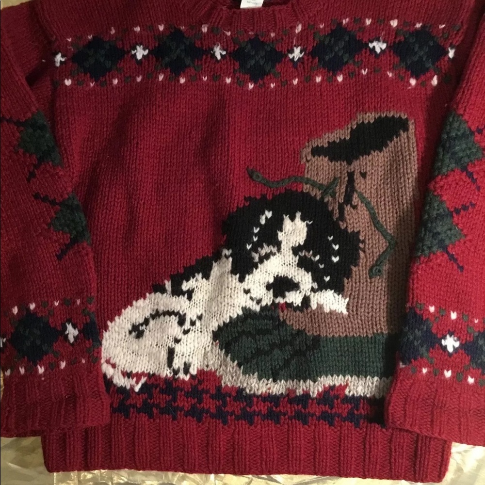 Woolrich puppy sleeping on boot sweater